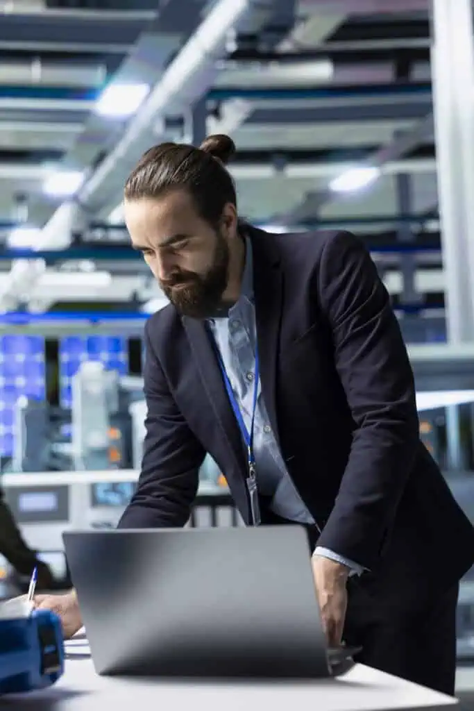 General director in formal suit conducting inspection in a solar panel plant, symbolizing modern infrastructure and leadership in green energy industry.