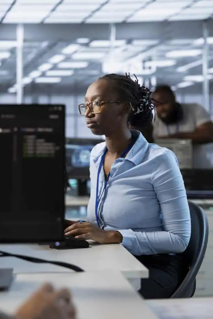 System administrator in data center optimizing IT infrastructure